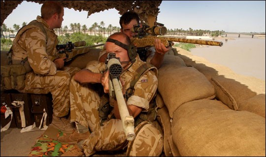 Sgt. Dan Mills and members of the sniper platoon on the roof of the CIMIC House