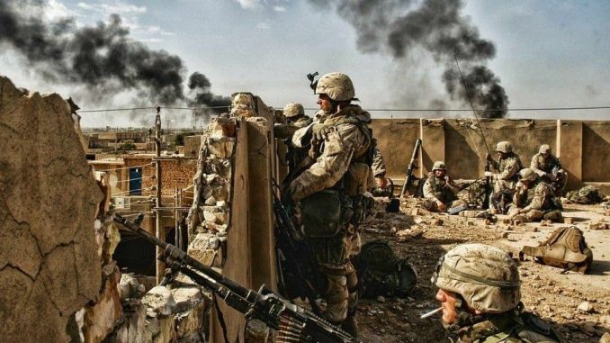 US Marines take up a position on a rooftop during the Second Battle for Fallujah (November 2004)